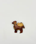 La broche "Camel"